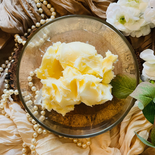 Shea butter in a clear bowl with a natural background