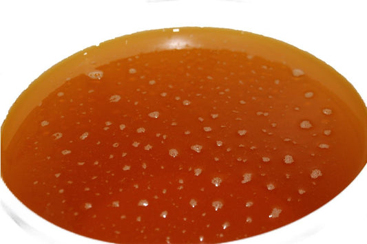 Bowl of jojoba oil golden organic