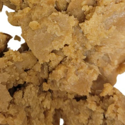 Close up of Batana oil on white background