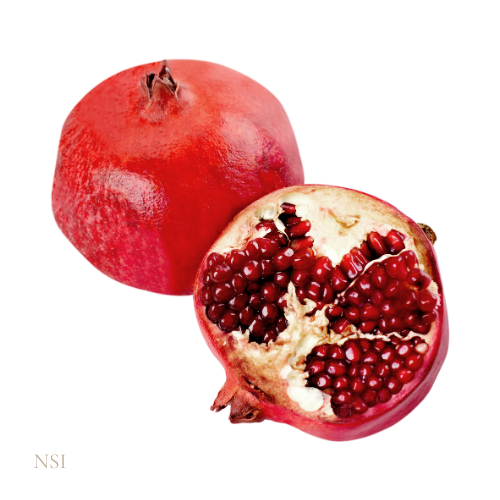 Close up of a whole pomegranate and a half, showing the seeds on a white background
