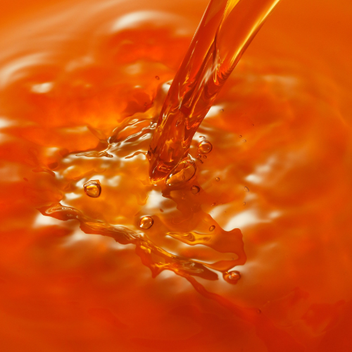 Close-up of T-50 TOCOPHEROLS VITAMIN E OIL, an amber viscous liquid