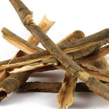 Close up of white willow bark on a white background