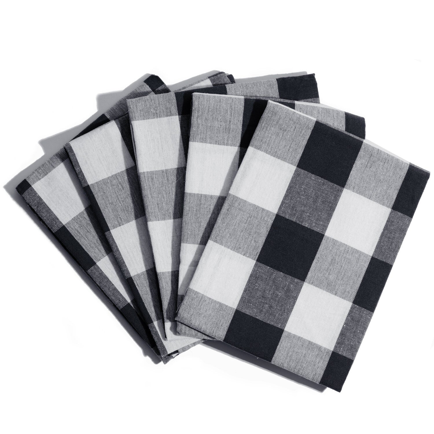 Set of black and white checkered napkins on a white background