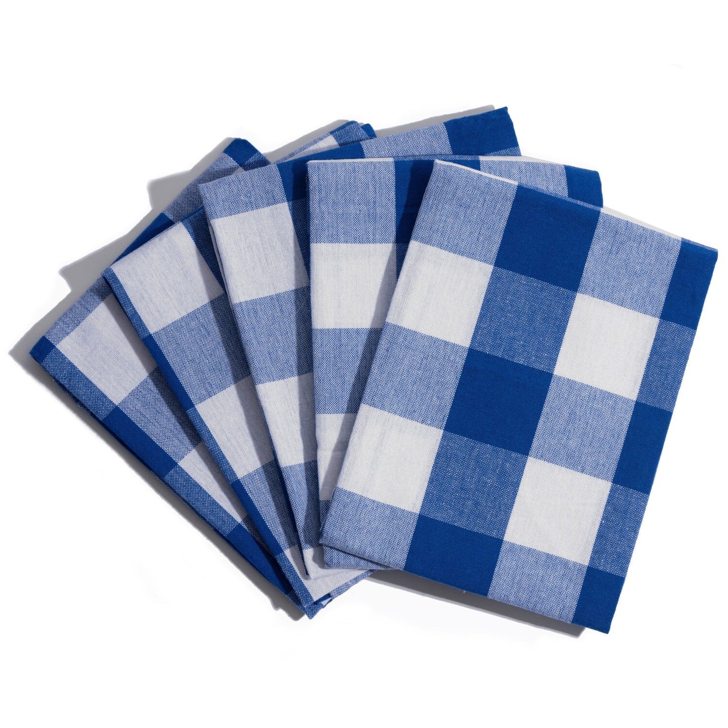 Set of blue and white checkered napkins on a white background