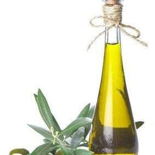 Bottle of Squalane oil (derived from olive oil) with an olive branch on a white background