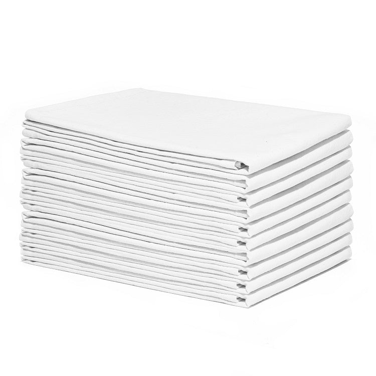 Stack of white folded towels on a white background