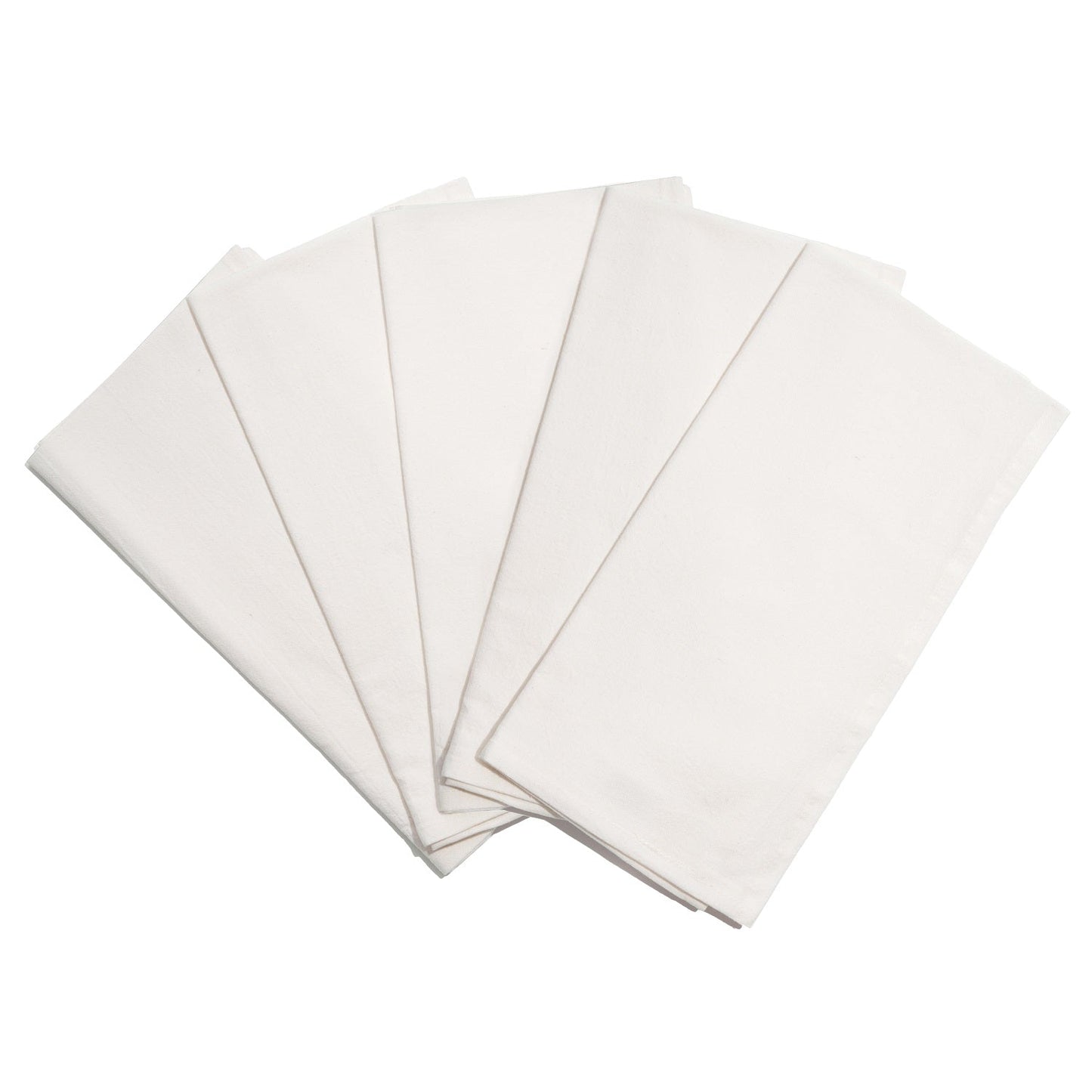 Five white napkins stacked on a white background
